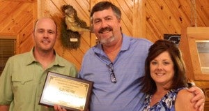 Shirley Burnhan / The Prentiss Headlight—Jeff Allen and his wife Nina accepted the 2014 Tree Farmer of the Year Award presented by  JDC Forestry Association VP James Fagan.