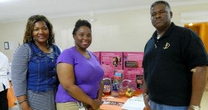 Shirley Burnham / The Prentiss Headlight—Pastor Hosea Brown knows the value of preventative screening after his heart valve problems and aneurysm were found on a routine check. Valerie Sullivan and Kristie Knox of the SE MS Rural health initiative, Inc. who provided information and HIV testing at the Health Fair with Pastor Brown.