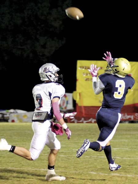 THE PRENTISS HEADLIGHT / #3 Tyler Shivers catches one of his four receptions of the night against the Rebels. Photo by Jennifer Hall, www.photosbyjenny.zenfolio.com