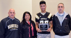 Shirley Burnham / The Prentiss Headlight—MHSAA Media Director Todd Kelly presented Bassfield football player Kenneth Island, pictured with his mom, with the Athlete-Scholar C-Spire Award.