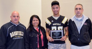 Shirley Burnham / The Prentiss Headlight—MHSAA Media Director Todd Kelly presented Bassfield football player Kenneth Island, pictured with his mom, with the Athlete-Scholar C-Spire Award. 