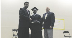 The Prentiss Headlight—Jefferson Davis County Superintendent presenting a high school diploma to Christopher Thompson. Also pictured is Assistant Principal Lance Mancuso.