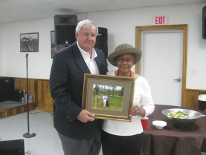 The Prentiss Headlight / JDC SWCD Chairman Herman Dungan presenting Queen Sutton with the 2015 Outstanding Grassland Small Ruminent Grower Award