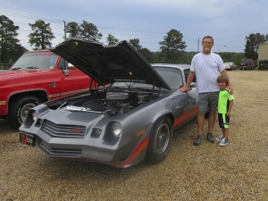 The Prentiss Headlight—Alderman Randy Stamps and grandson Corbin at the car show during the second annual extravaganza. Stamps placed second in the car show’s classic category.