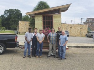 Holley Cochran / The Prentiss Headlight—The very first Tiny House Life Space garden shed rolled off the assembly line last week. The shed is made of reclaimed materials including the window from the original Belhaven College in Jackson.  This garden shed retails for $3300 dollars and will be donated to Unity in the Community. Unity will be selling chances to win the shed, with all proceeds going to Unity in the Community. Chances are $5 each or 3 for $10. See any Unity member for chances or contact Dianna Hutchinson at 601-508-0590 for more information.