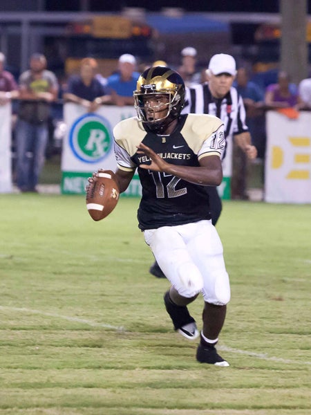 The Prentiss Headlight / Tony Waits—Jackets' quarterback Cason Sims looks to connect with a receiver in Friday night's game