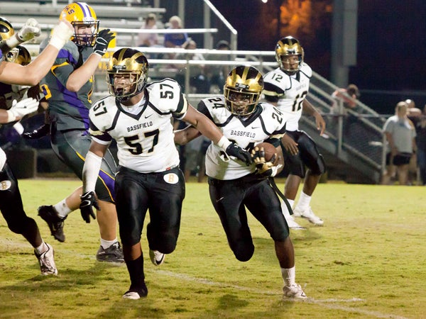 The Prentiss Headlight / Tony Waits —Carneilus Booth #57 leads the way as Chris Thompson #12 makes his way down the field in the Jackets' game against Purvis Friday night.
